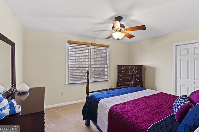 bedroom featuring baseboards, a ceiling fan, and carpet floors