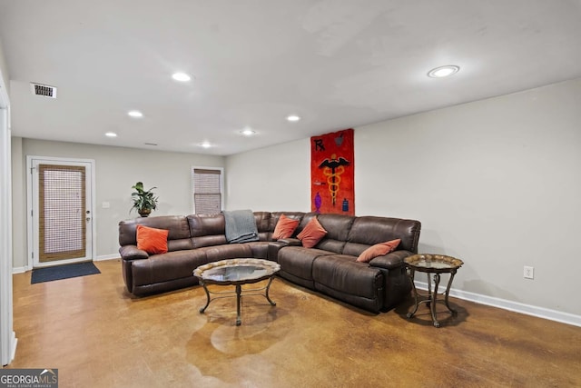 living room featuring recessed lighting, visible vents, baseboards, and concrete flooring