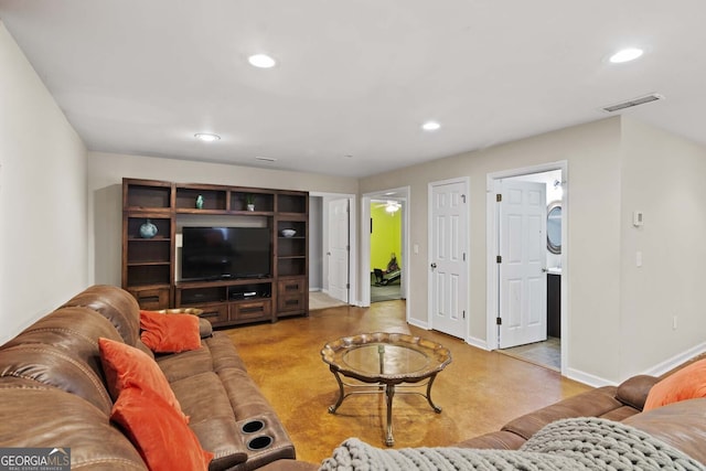 living area with visible vents, baseboards, and recessed lighting
