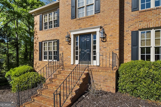 entrance to property with brick siding