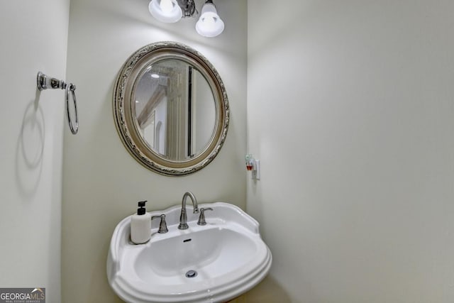 1806 Royal Troon Ct, Duluth, GA 30097 - bathroom featuring a sink and a chandelier