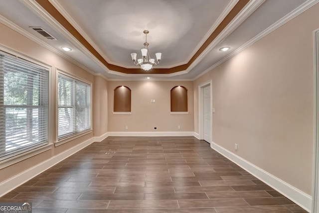 1806 Royal Troon Ct, Duluth, GA 30097 - spare room with a chandelier, crown molding, a raised ceiling, dark wood-type flooring, and recessed lighting