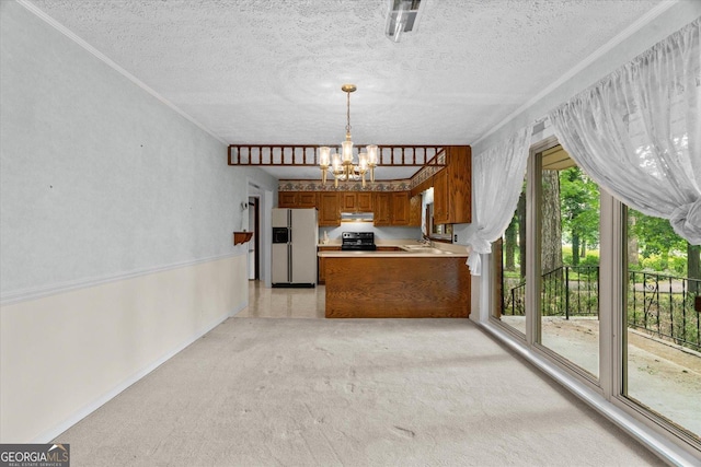 1070 Lovers Lane Rd SE, Calhoun, GA 30701 - kitchen with white refrigerator with ice dispenser, brown cabinets, under cabinet range hood, a chandelier, and black range