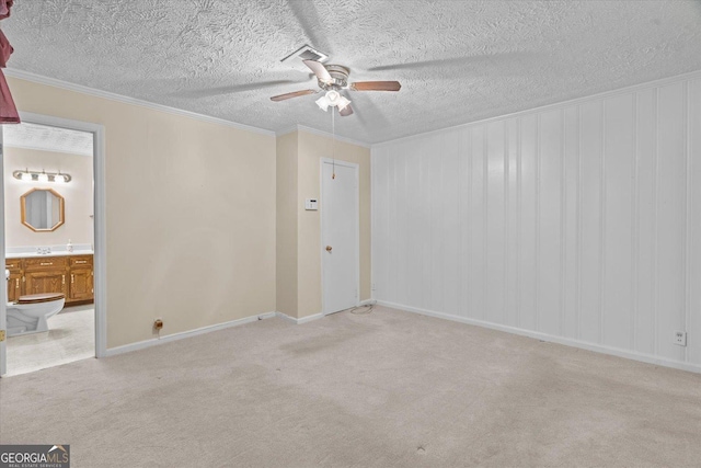 1070 Lovers Lane Rd SE, Calhoun, GA 30701 - carpeted spare room with a ceiling fan, baseboards, crown molding, and a textured ceiling