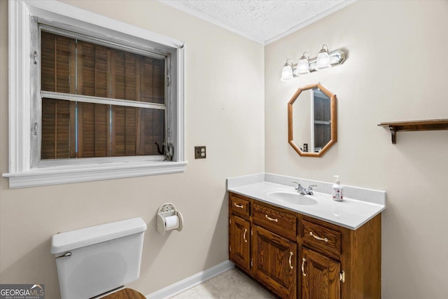 1070 Lovers Lane Rd SE, Calhoun, GA 30701 - bathroom featuring vanity, toilet, baseboards, a textured ceiling, and ornamental molding