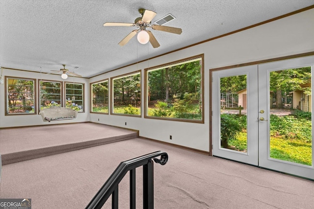 1070 Lovers Lane Rd SE, Calhoun, GA 30701 - unfurnished sunroom with ceiling fan and french doors