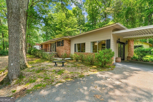 1070 Lovers Lane Rd SE, Calhoun, GA 30701 - ranch-style house with driveway, brick siding, and an attached carport