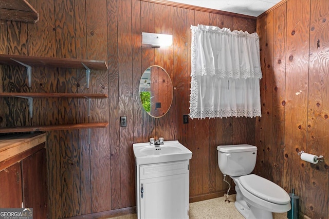 1070 Lovers Lane Rd SE, Calhoun, GA 30701 - half bathroom with vanity, wood walls, toilet, and baseboards