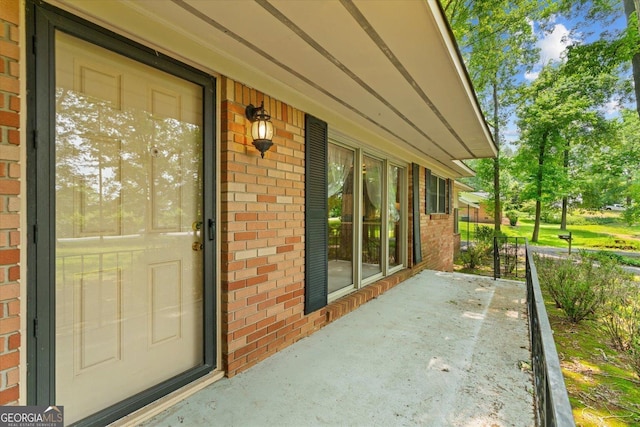 1070 Lovers Lane Rd SE, Calhoun, GA 30701 - doorway to property featuring brick siding and covered porch