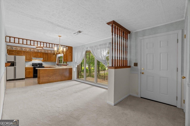 1070 Lovers Lane Rd SE, Calhoun, GA 30701 - kitchen featuring white fridge with ice dispenser, black / electric stove, brown cabinetry, a chandelier, and a sink