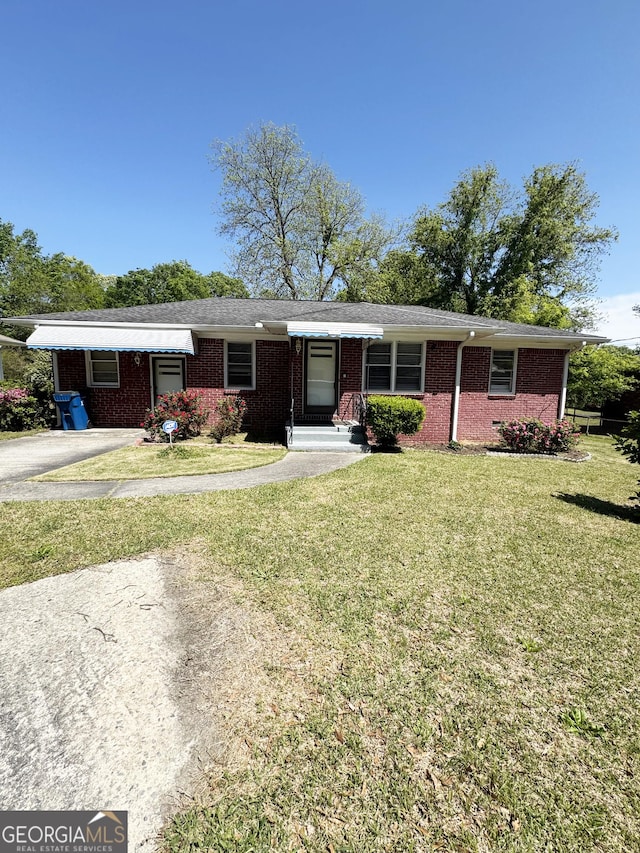 6718 Delta Dr, Riverdale, GA 30274 - ranch-style house featuring brick siding and a front lawn
