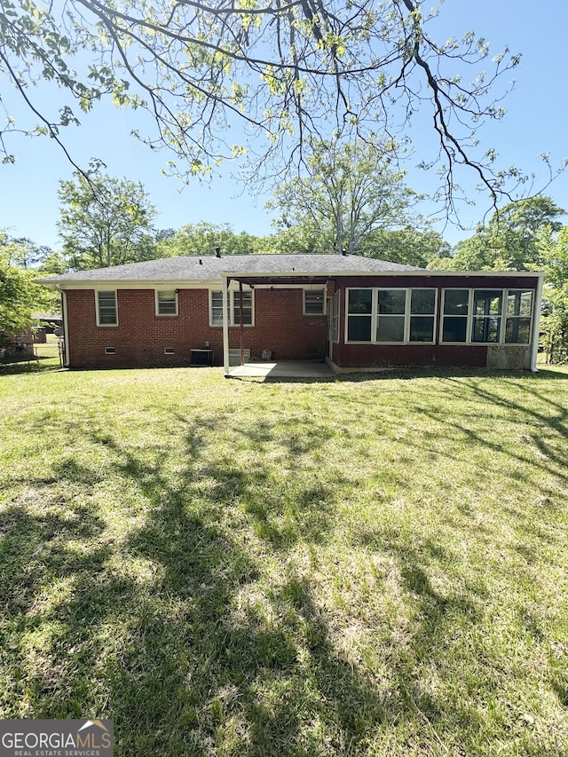 6718 Delta Dr, Riverdale, GA 30274 - back of property with a yard, crawl space, central AC, and a sunroom