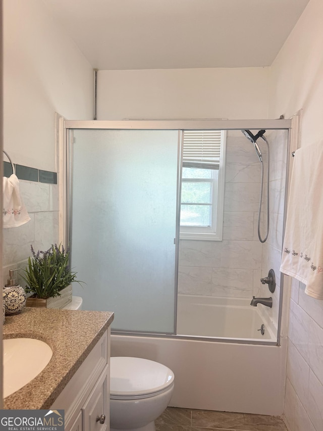 6718 Delta Dr, Riverdale, GA 30274 - full bath with toilet, vanity, combined bath / shower with glass door, and tile walls