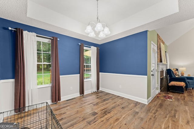 791 Thornwood Cir, Mount Airy, GA 30563 - unfurnished room with a chandelier, wood finished floors, lofted ceiling, and baseboards