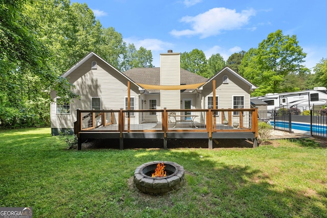 791 Thornwood Cir, Mount Airy, GA 30563 - rear view of property with a garage, a chimney, and a deck