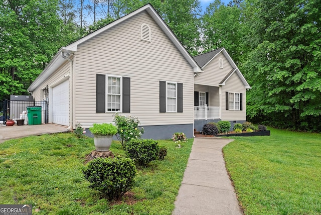 791 Thornwood Cir, Mount Airy, GA 30563 - view of front of home with a front lawn, an attached garage, driveway, and a porch