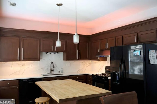 745 Abbotts Mill Ct, Duluth, GA 30097 - kitchen featuring dark brown cabinets, black appliances, under cabinet range hood, visible vents, and a sink