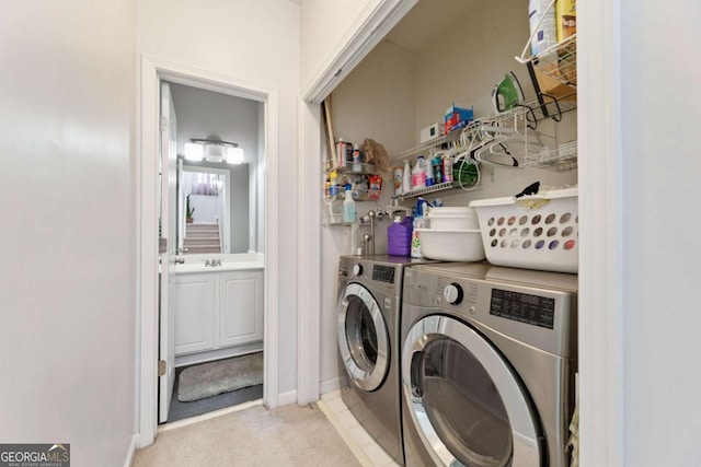 745 Abbotts Mill Ct, Duluth, GA 30097 - laundry room featuring laundry area, a sink, light carpet, and washer and clothes dryer