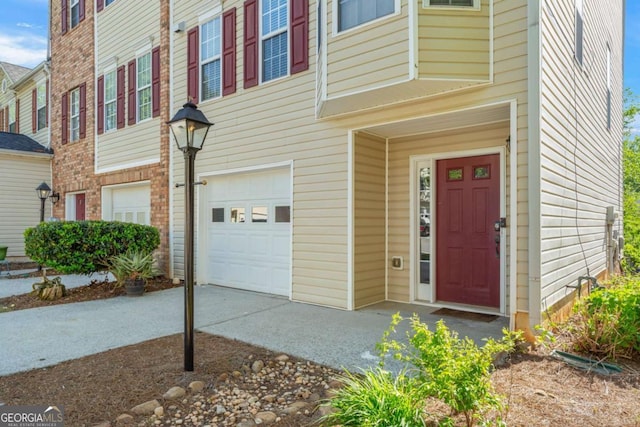 745 Abbotts Mill Ct, Duluth, GA 30097 - view of exterior entry featuring a garage