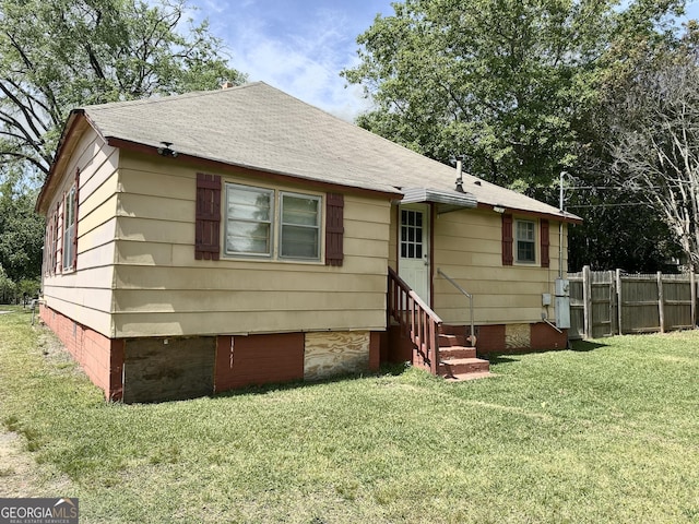 3002 24th Ave, Valley, AL 36854 - back of property with entry steps, crawl space, and a shingled roof