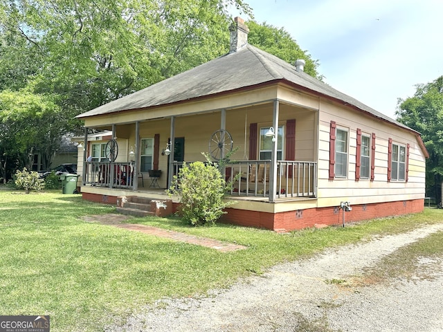 3002 24th Ave, Valley, AL 36854 - view of front facade with covered porch, a front lawn, a chimney, and crawl space