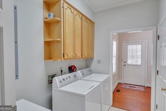 485 Fussell Rd, Leesburg, GA 31763 - washroom featuring baseboards, ornamental molding, cabinet space, washer and dryer, and light wood finished floors