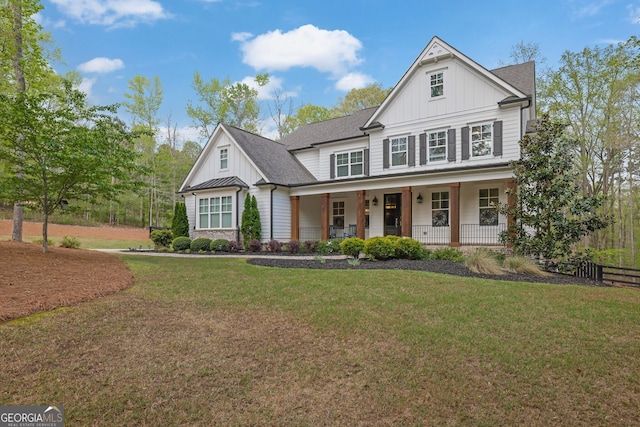 123 Townsend Pass, Alpharetta, GA 30004 - view of front facade featuring board and batten siding, covered porch, a front yard, and a shingled roof