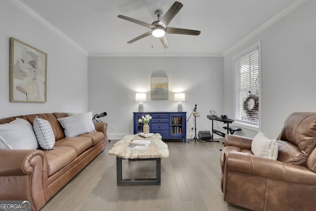 123 Townsend Pass, Alpharetta, GA 30004 - living room with ornamental molding, a ceiling fan, and light wood-type flooring