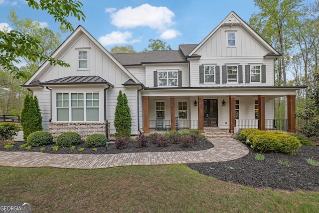 123 Townsend Pass, Alpharetta, GA 30004 - modern farmhouse featuring board and batten siding, a porch, brick siding, and a standing seam roof