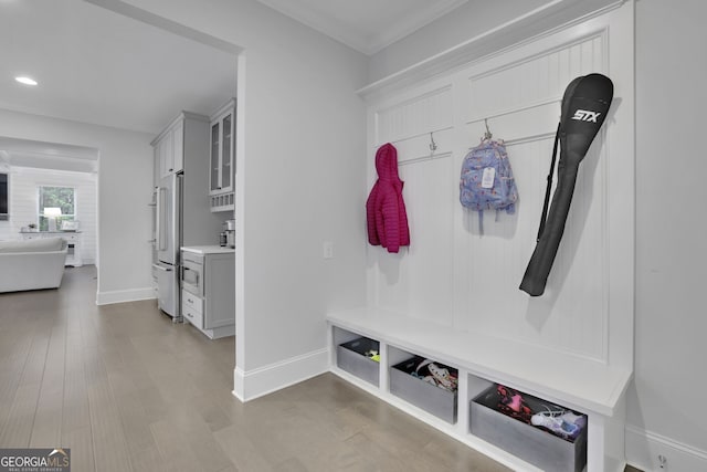 123 Townsend Pass, Alpharetta, GA 30004 - mudroom featuring recessed lighting, wood finished floors, and ornamental molding