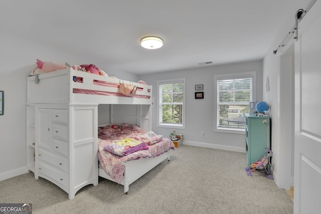 123 Townsend Pass, Alpharetta, GA 30004 - bedroom featuring a barn door and light colored carpet