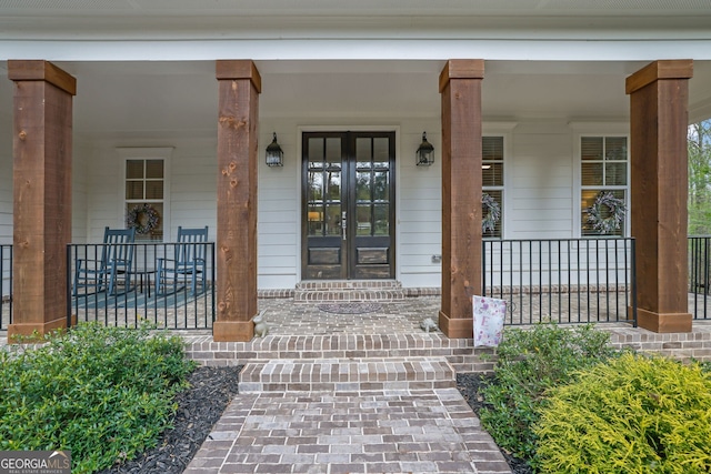 123 Townsend Pass, Alpharetta, GA 30004 - view of exterior entry featuring a porch and french doors