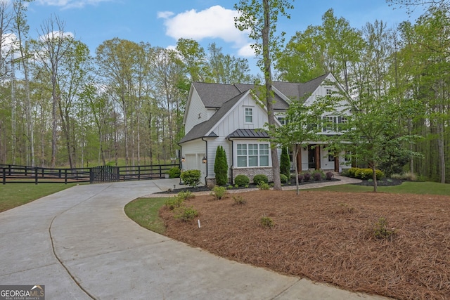123 Townsend Pass, Alpharetta, GA 30004 - view of front of house with driveway, board and batten siding, a gate, and roof with shingles