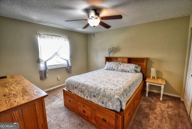 bedroom featuring dark carpet, baseboards, ceiling fan, and a textured ceiling