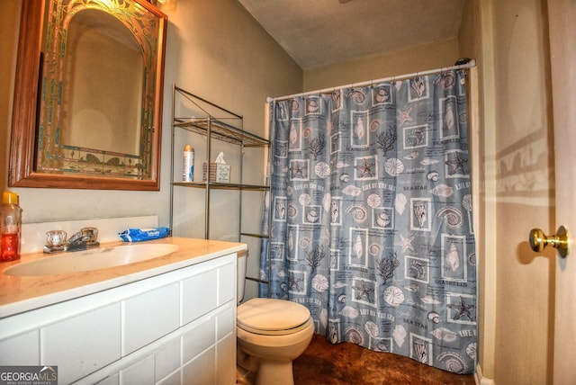bathroom featuring toilet, vanity, and a shower with curtain