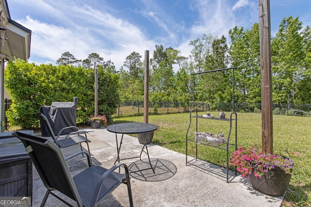 view of patio / terrace featuring fence