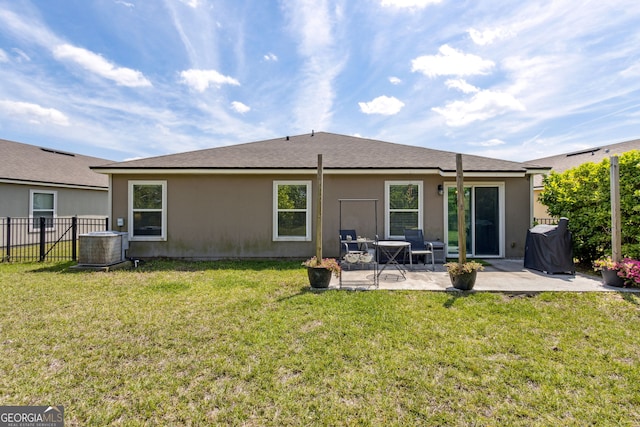 back of house with a yard, a patio, fence, and central AC unit