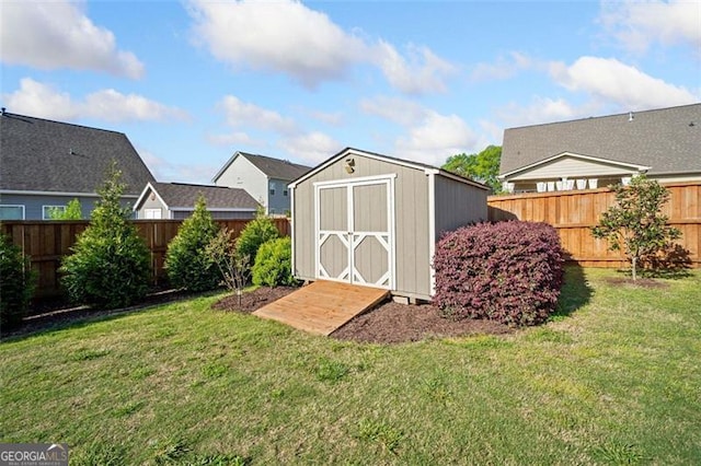 view of shed with a fenced backyard