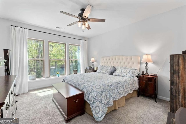 bedroom featuring visible vents, baseboards, ceiling fan, and carpet floors