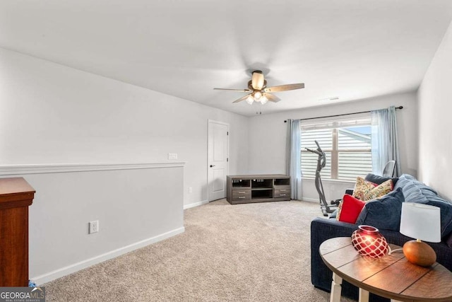 living area with baseboards, a ceiling fan, and carpet floors