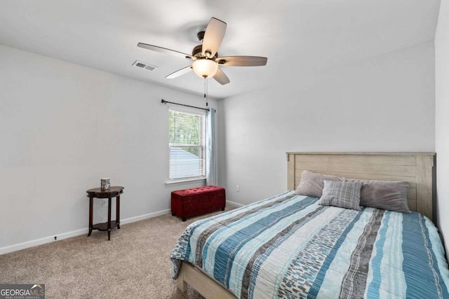 bedroom with a ceiling fan, baseboards, carpet, and visible vents