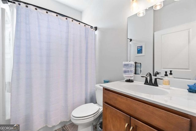 full bathroom with vanity and toilet