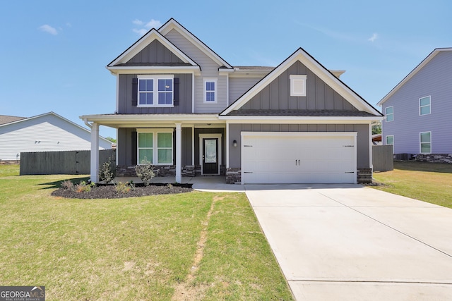craftsman house with a front yard, a porch, board and batten siding, and fence