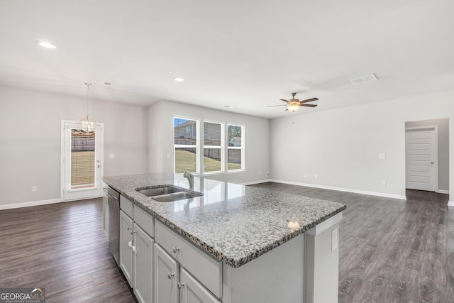 kitchen with stainless steel dishwasher, dark wood-style flooring, a sink, and ceiling fan