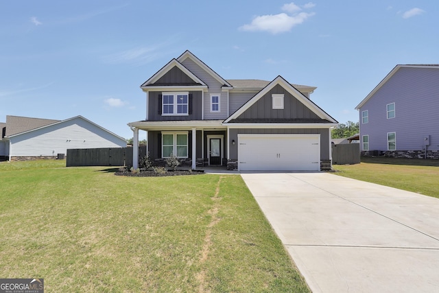 craftsman-style home with board and batten siding, a front yard, and fence