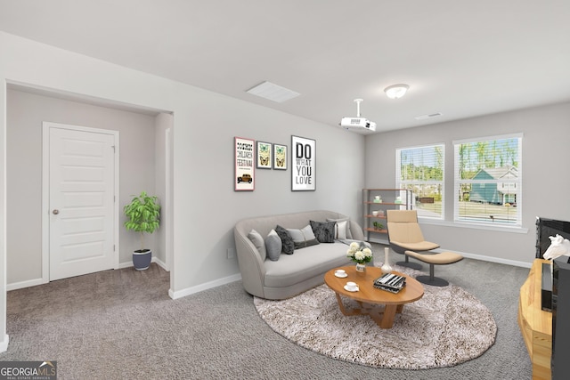 carpeted living area with baseboards and visible vents