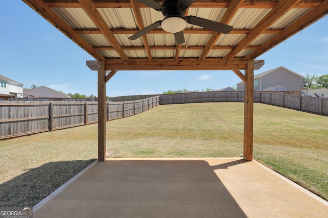 view of yard featuring a patio, a fenced backyard, and a ceiling fan