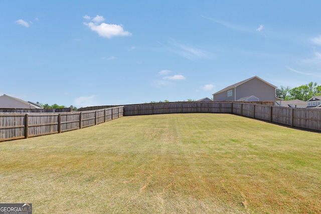 view of yard featuring a fenced backyard