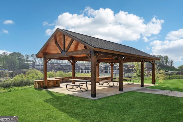 surrounding community featuring a gazebo, a patio area, and a lawn