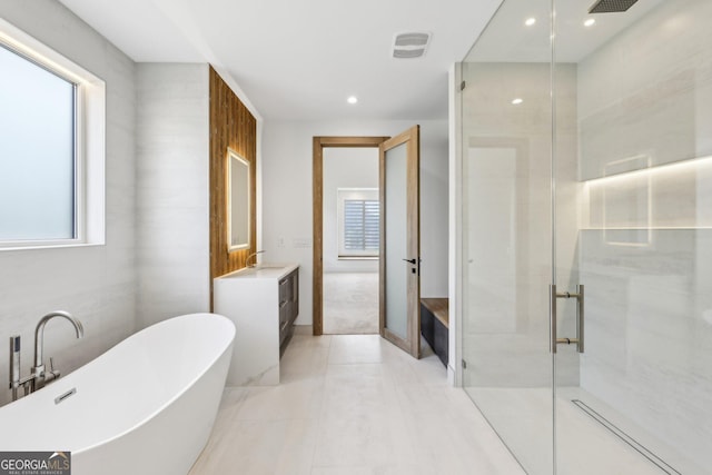 bathroom featuring a soaking tub, a shower stall, vanity, visible vents, and recessed lighting